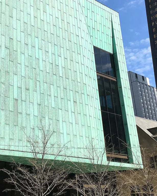 Historic Chicago building with a large verdigris architectural patina finish