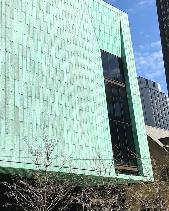 Modern building with green facade in an urban setting Jax Patina Agent Verdigris