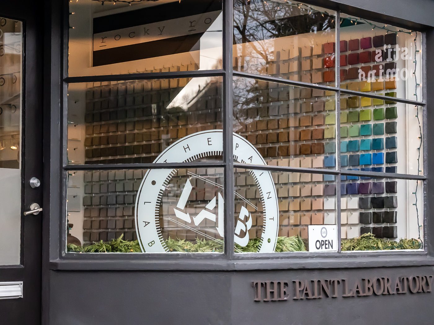 The Paint Laboratory storefront and hand-painted color display in Seattle