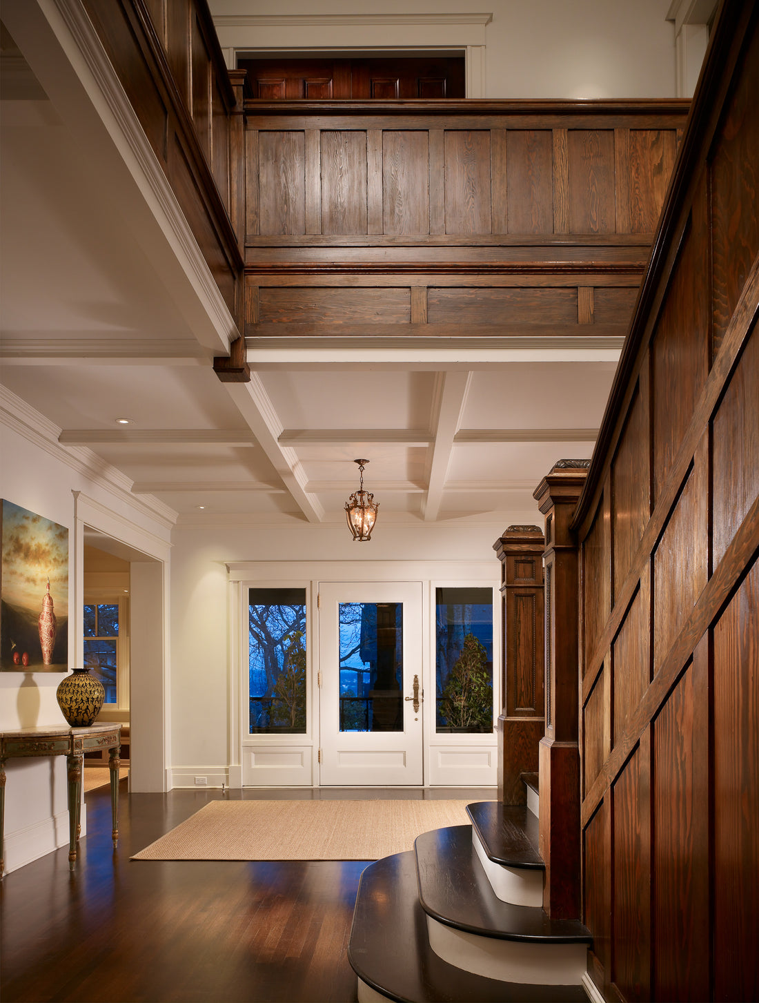 Completed entry hall with coordinated architectural paint and stained woodwork
